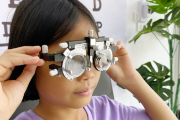 Photograph of girl having an eye test