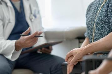 A generic photograph of people in a medical consulting room